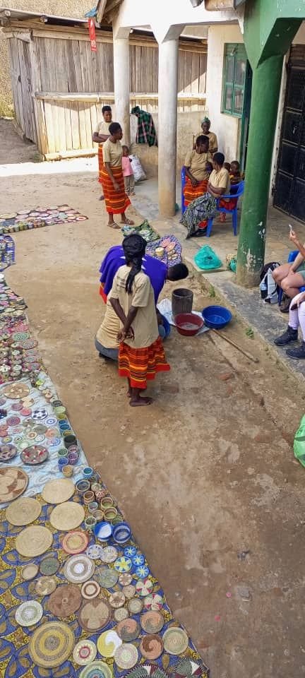 Women basket weaving near Bwindi, highlighting the practical craft traditions and community experiences that often complement gorilla trekking itineraries.