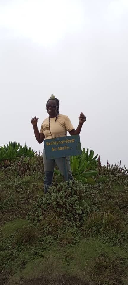Guest at the summit of Sabinyo Peak in the Virunga Mountains